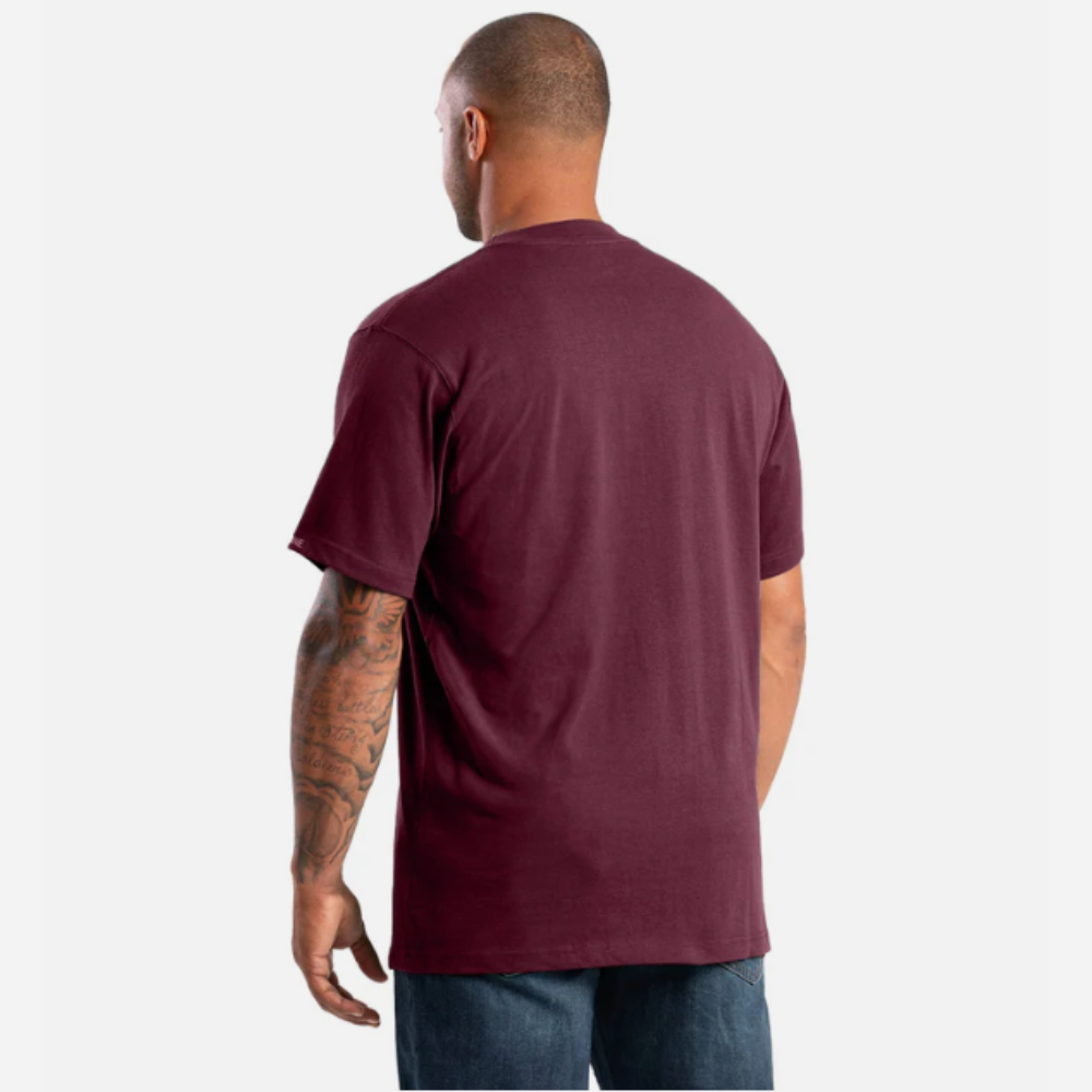 Man wearing a maroon t-shirt on a white background