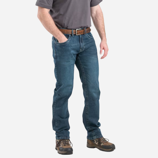 Person wearing blue jeans and a gray shirt on a white background