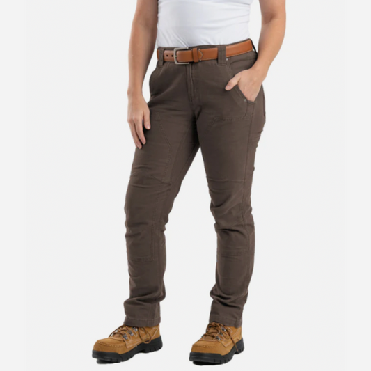 Person wearing brown pants with a white background