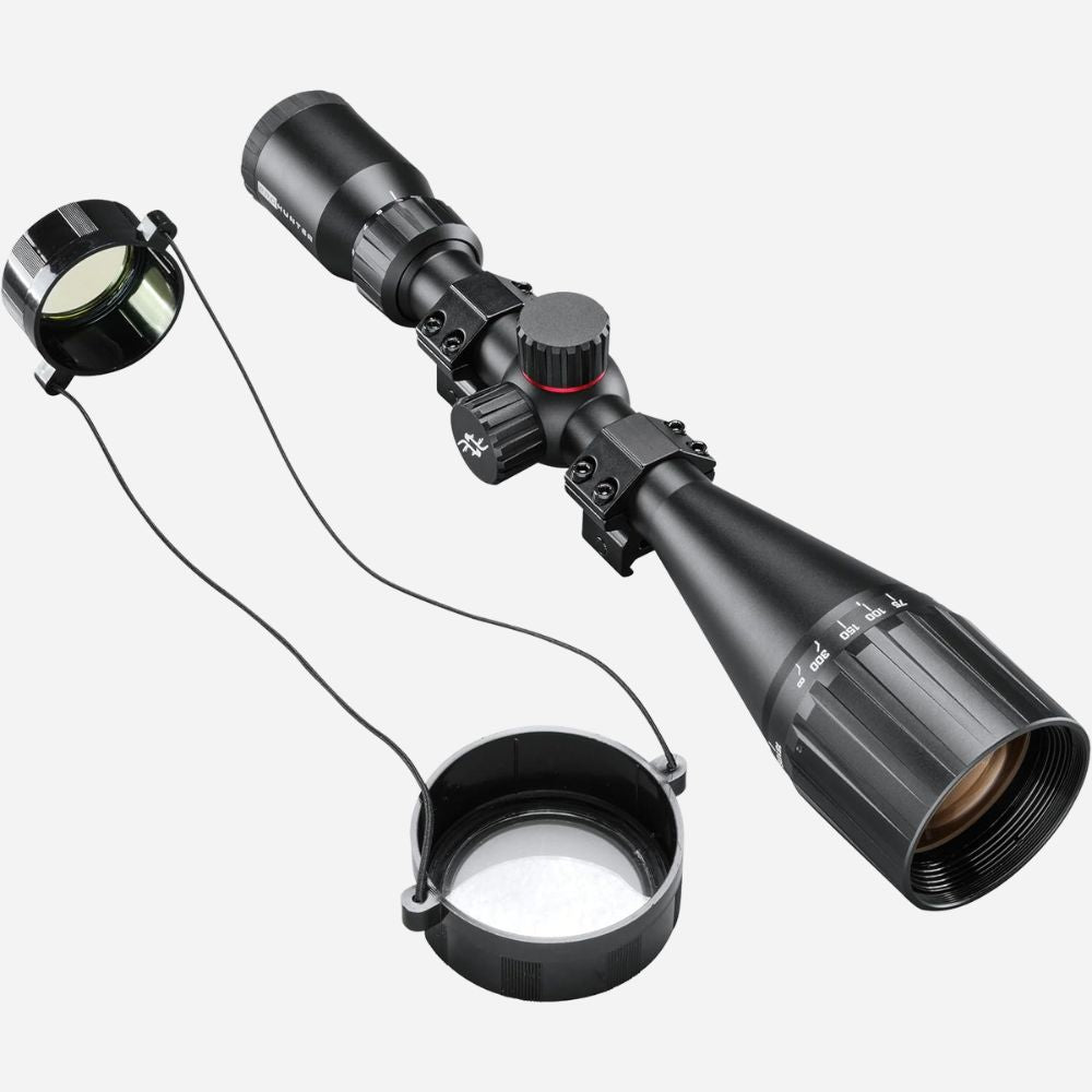Riflescope with attached light on a white background