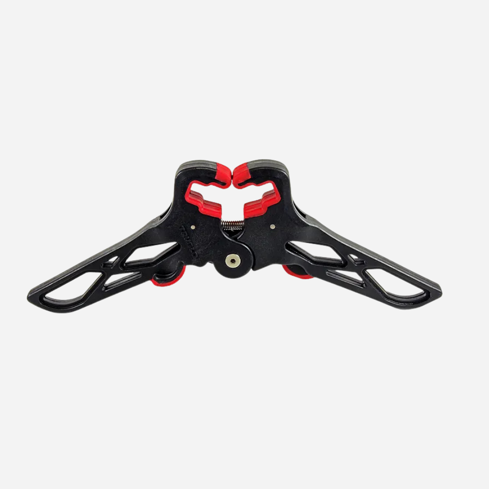 Black and red mechanical component on a white background