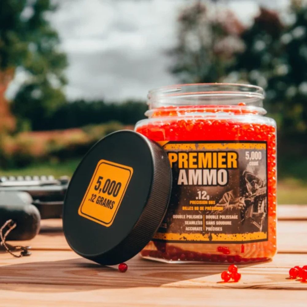 Jar of Premier Ammo with red contents on a wooden surface outdoors