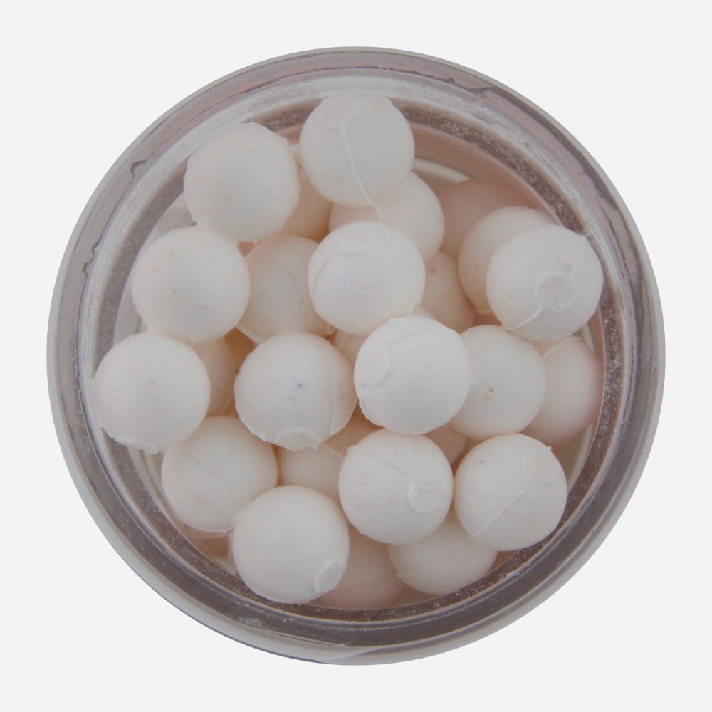 White spherical objects in a clear container on a white background