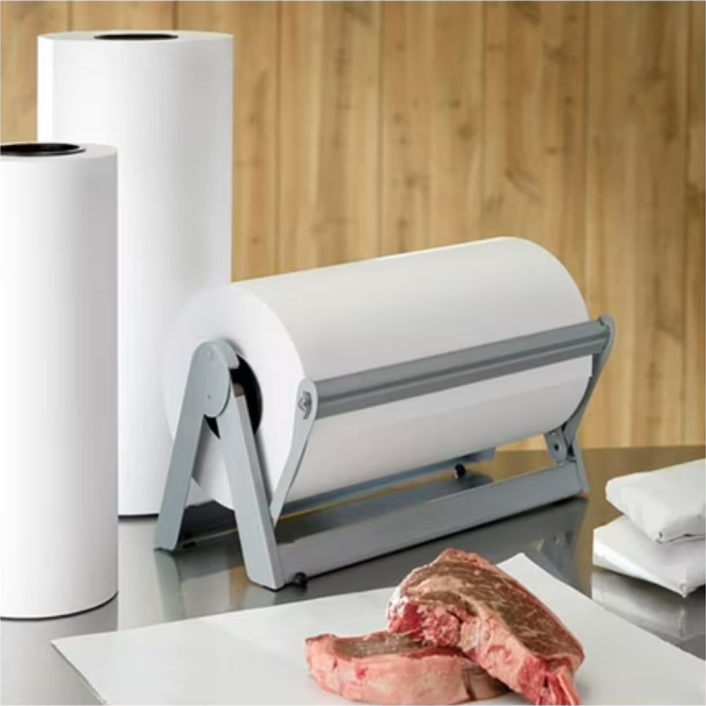 Roll of paper towel with a holder on a kitchen counter, with a wooden wall in the background.