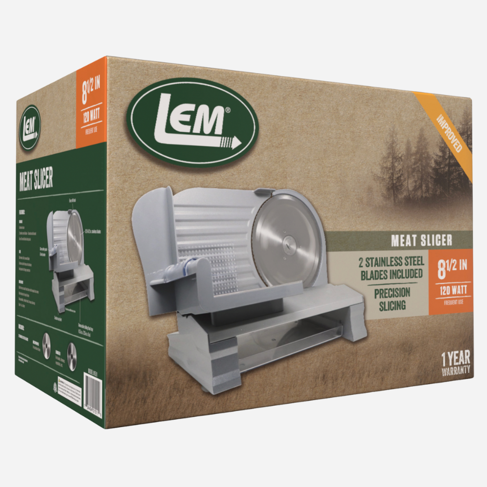 Box of LEM meat slicer with product image and specifications on a beige background