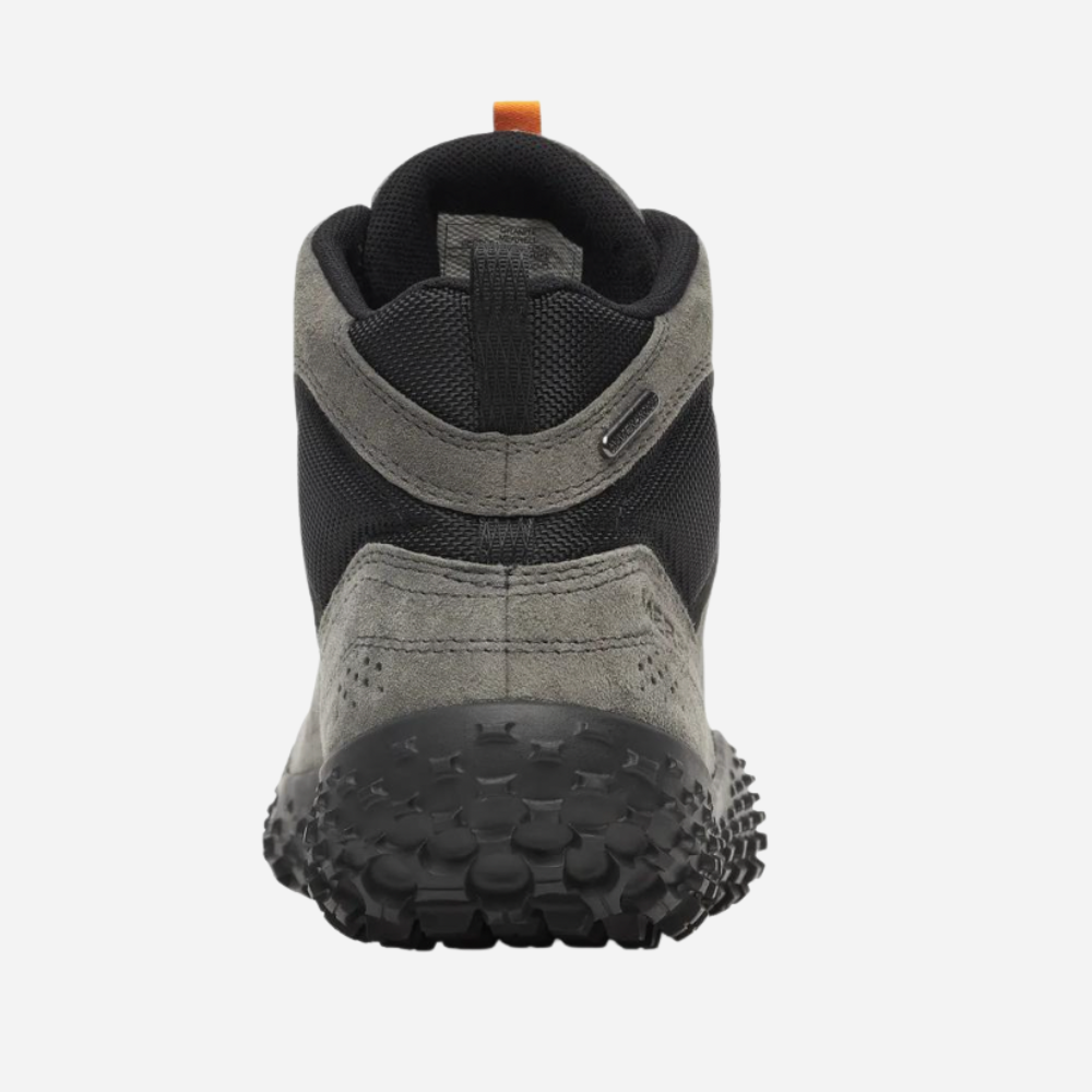 Gray and black shoe with textured sole on a white background