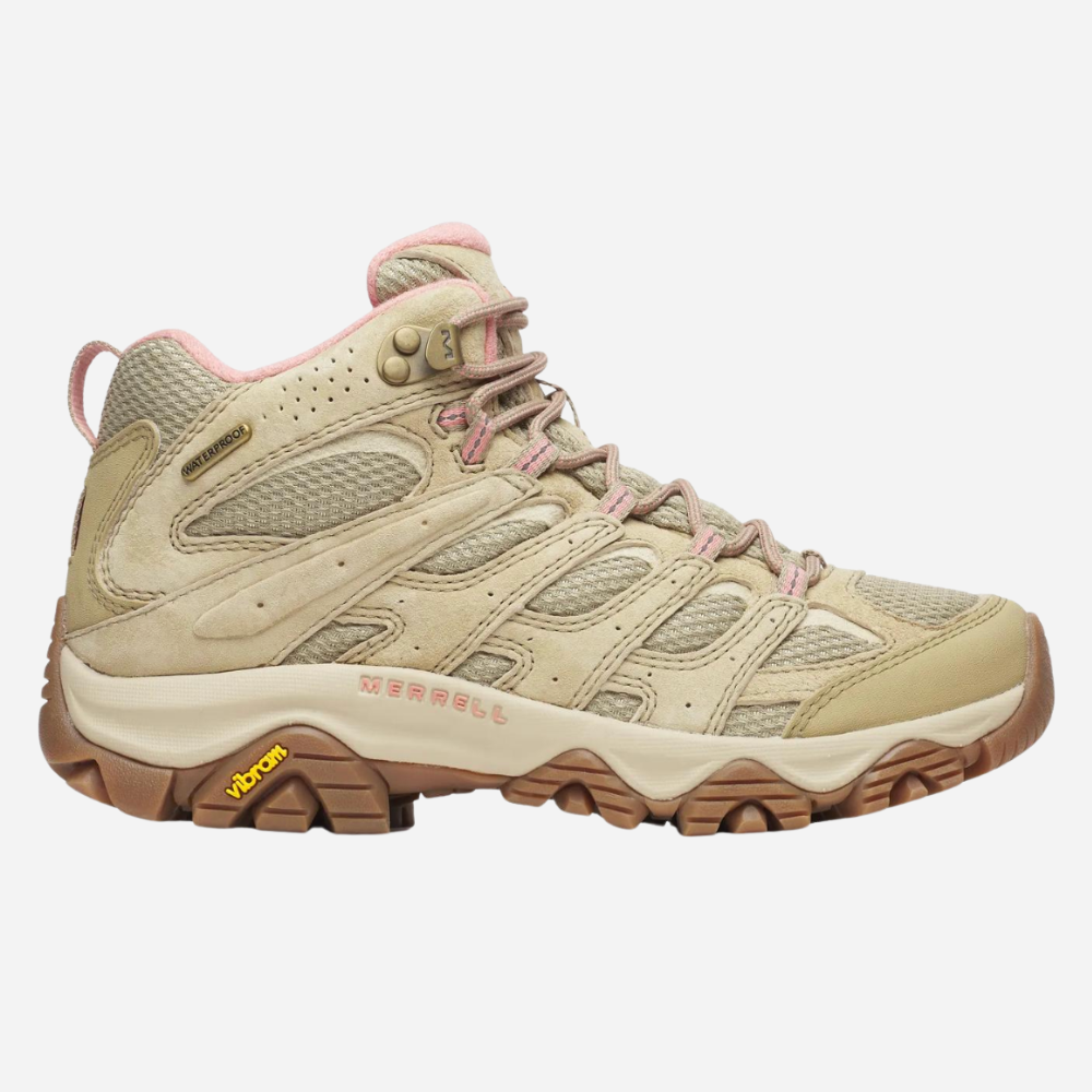 Beige hiking boot with pink accents on a white background