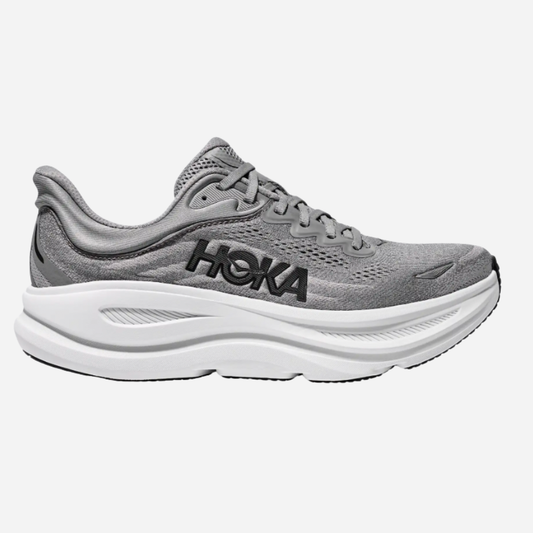 Gray running shoe with white sole on a white background