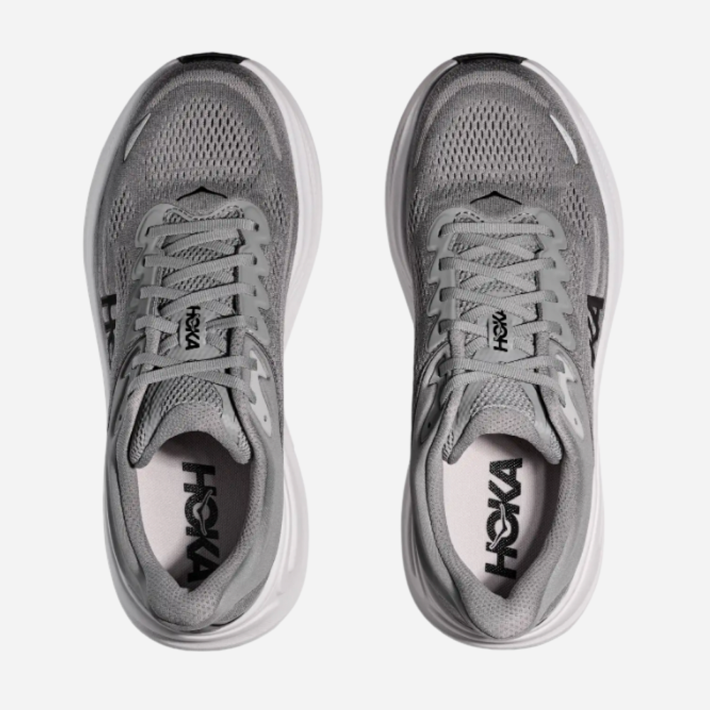 Pair of gray running shoes with 'Hoka' branding on a white background