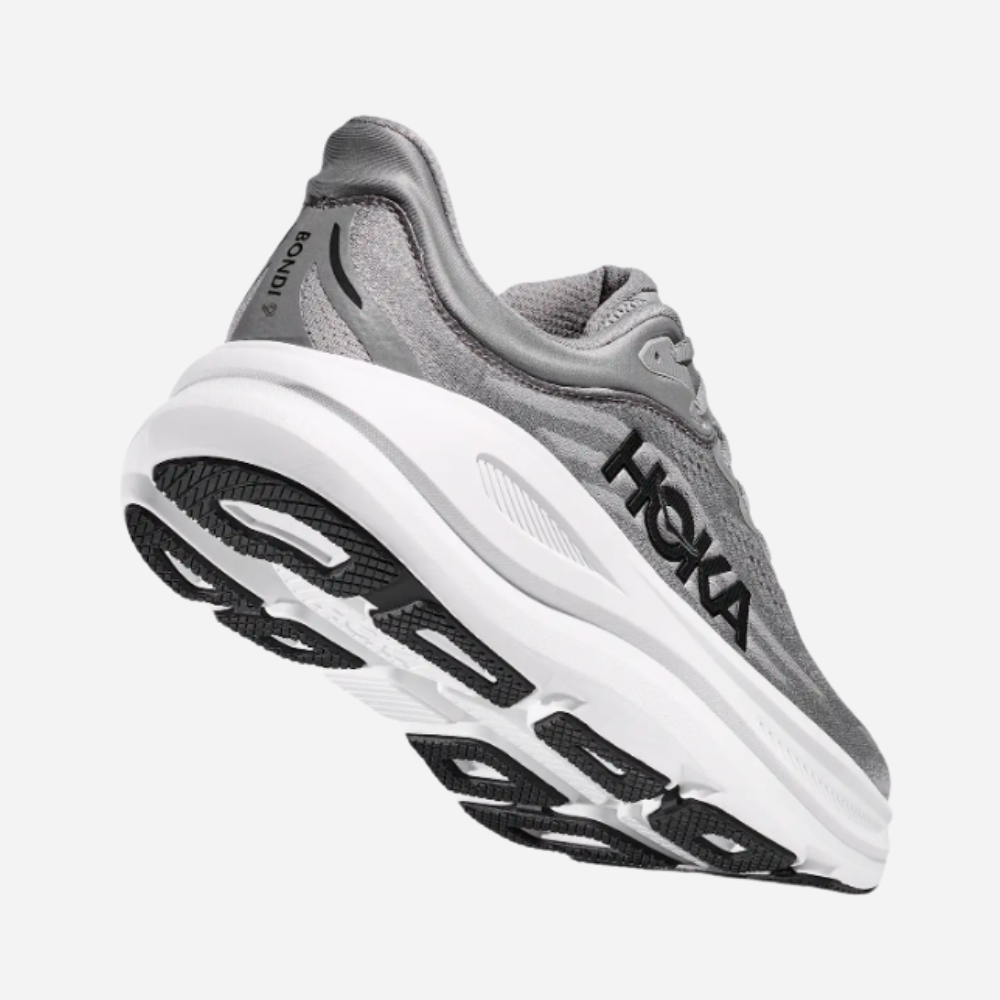 Gray running shoe with white sole on a white background