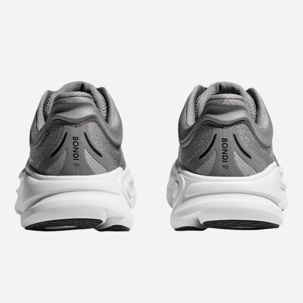 Gray running shoes with white soles on a light gray background