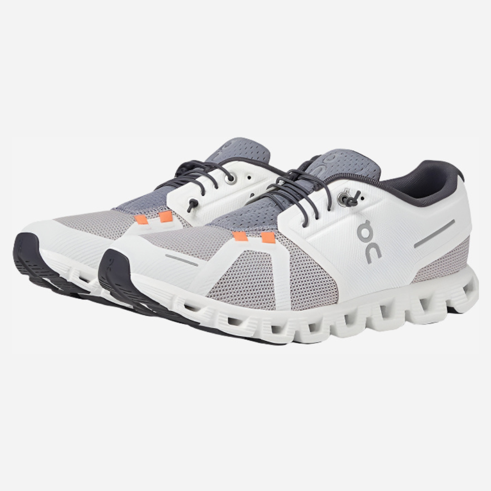 White and gray running shoes with a unique sole design on a white background