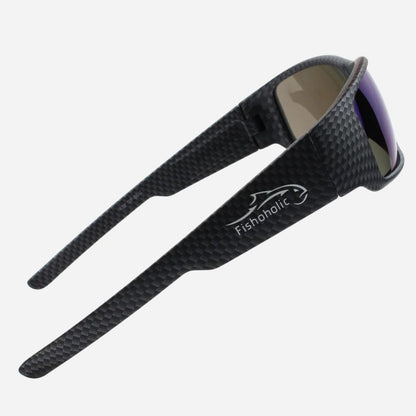 Black carbon-fiber-textured sunglasses with a white Fishoholic logo on the temple, shown against a light gray background.