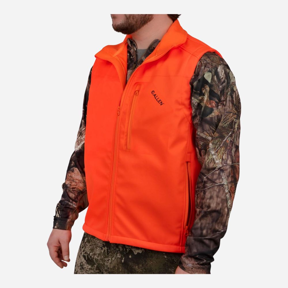 Orange hunting vest with camouflage sleeves on a white background