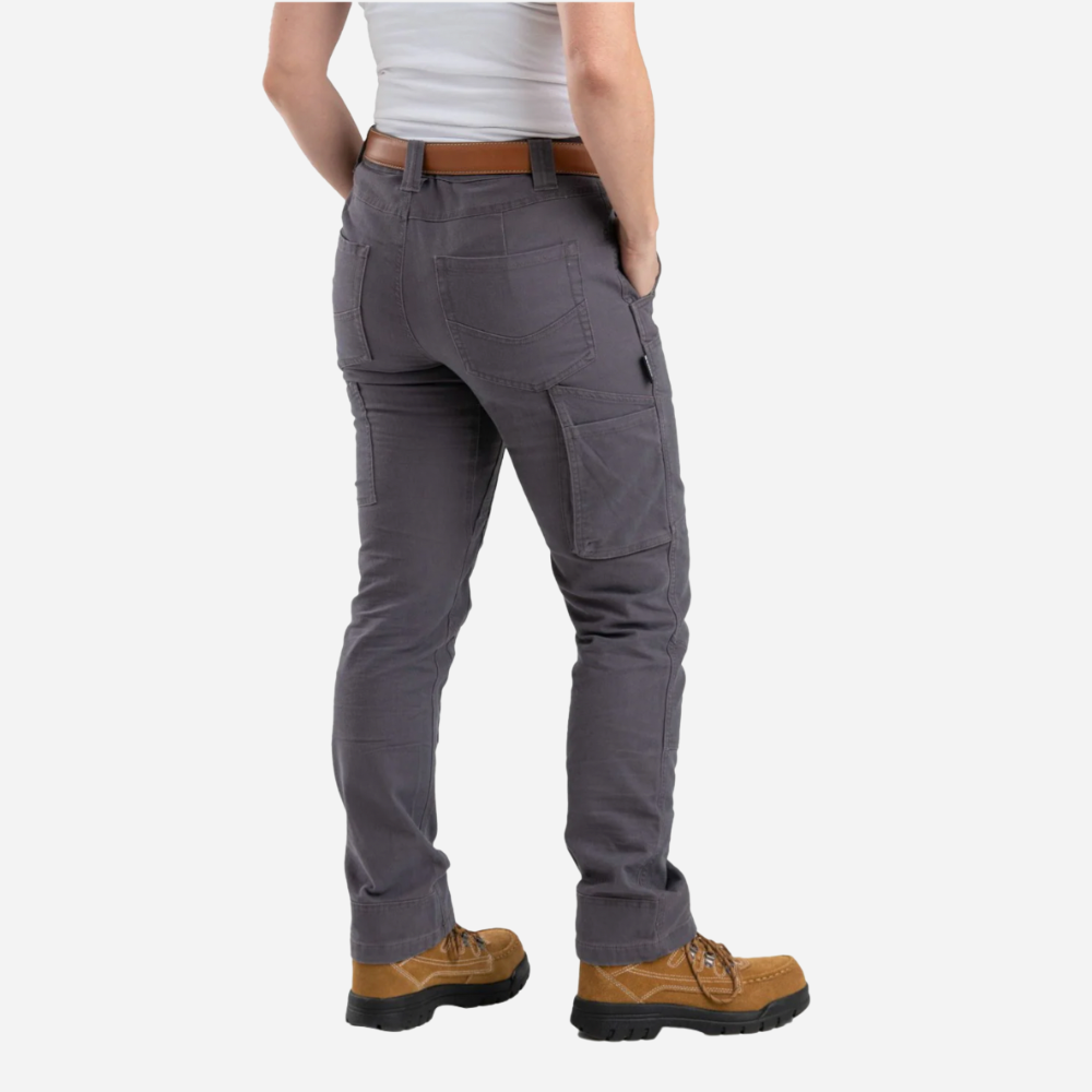 Person wearing gray cargo pants with a white background