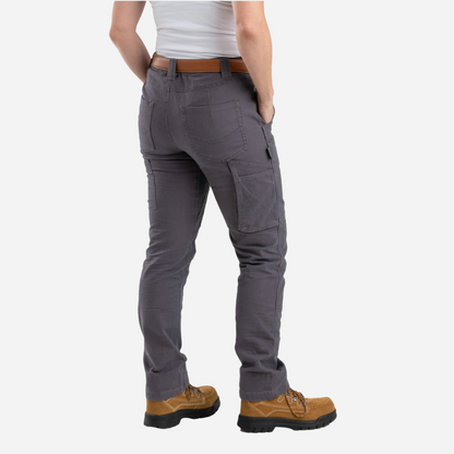 Person wearing gray cargo pants with a white background