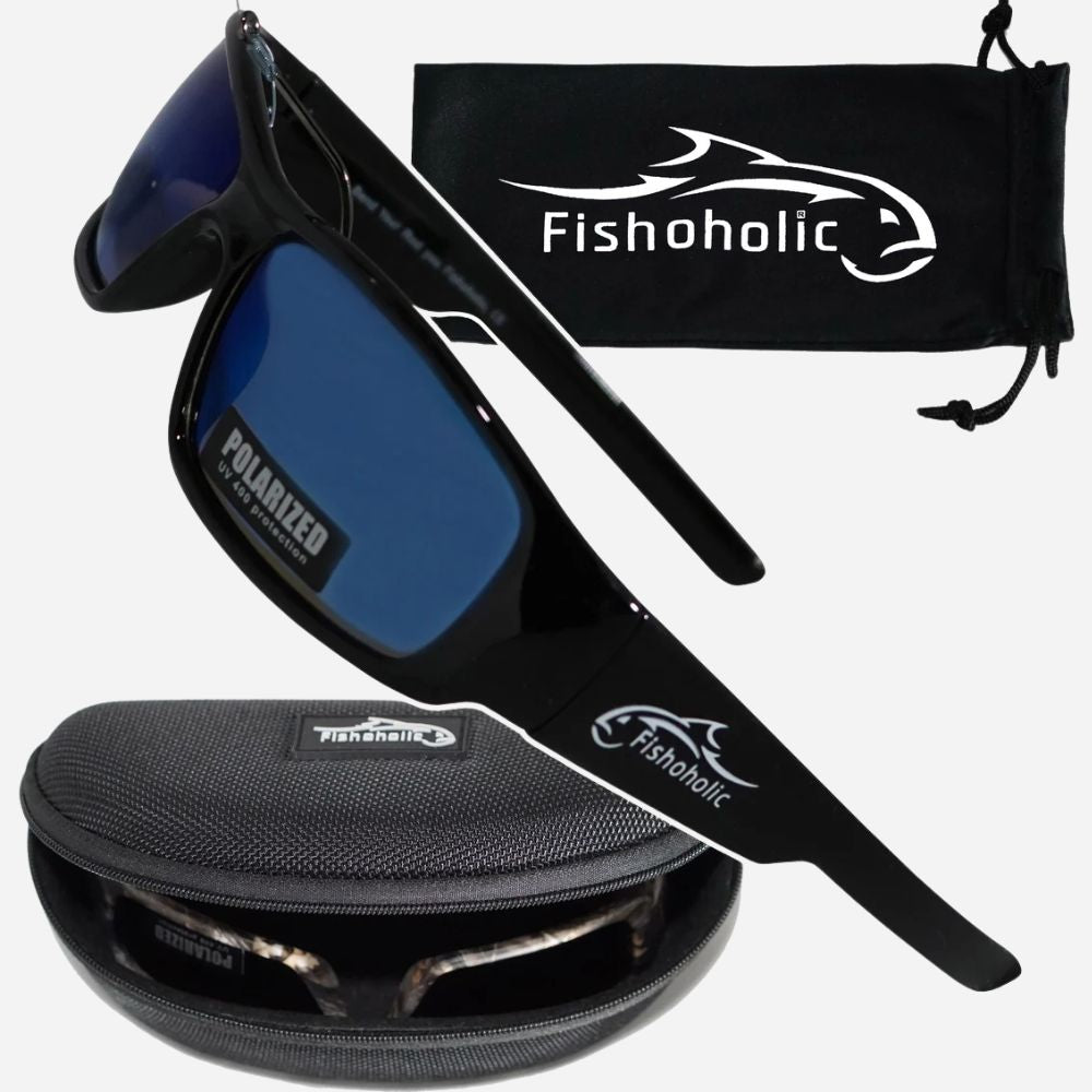 Black polarized sunglasses with blue lenses, shown with a black drawstring pouch and a hard case. The Fishoholic brand name and logo are visible on the glasses, pouch, and case.