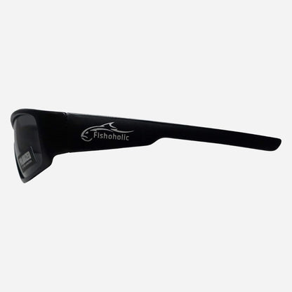 Black wrap-around sunglasses with a white Fishoholic logo printed on the side, shown against a light gray background.