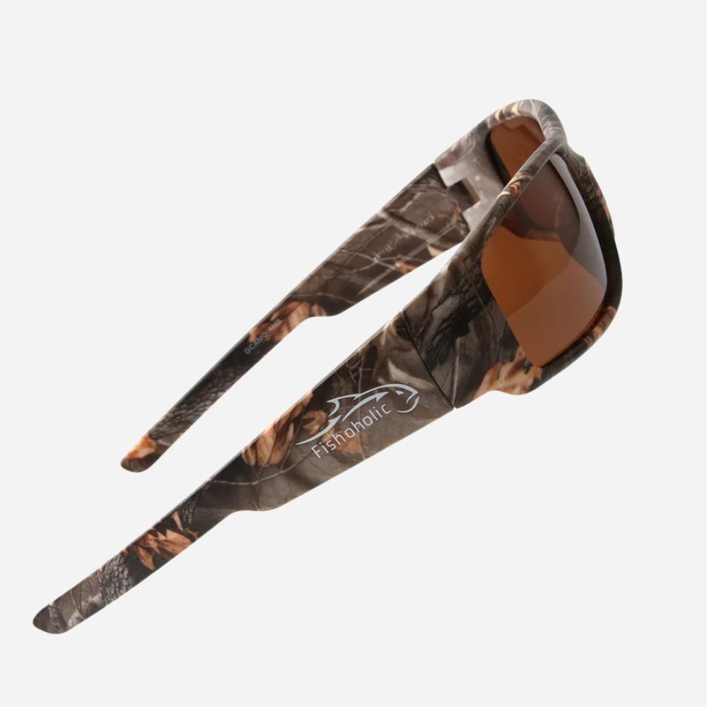 Fishmolic sunglasses with a brown and black woodland camouflage pattern on the frames and temples, featuring brown tinted lenses, shown on a light gray background.