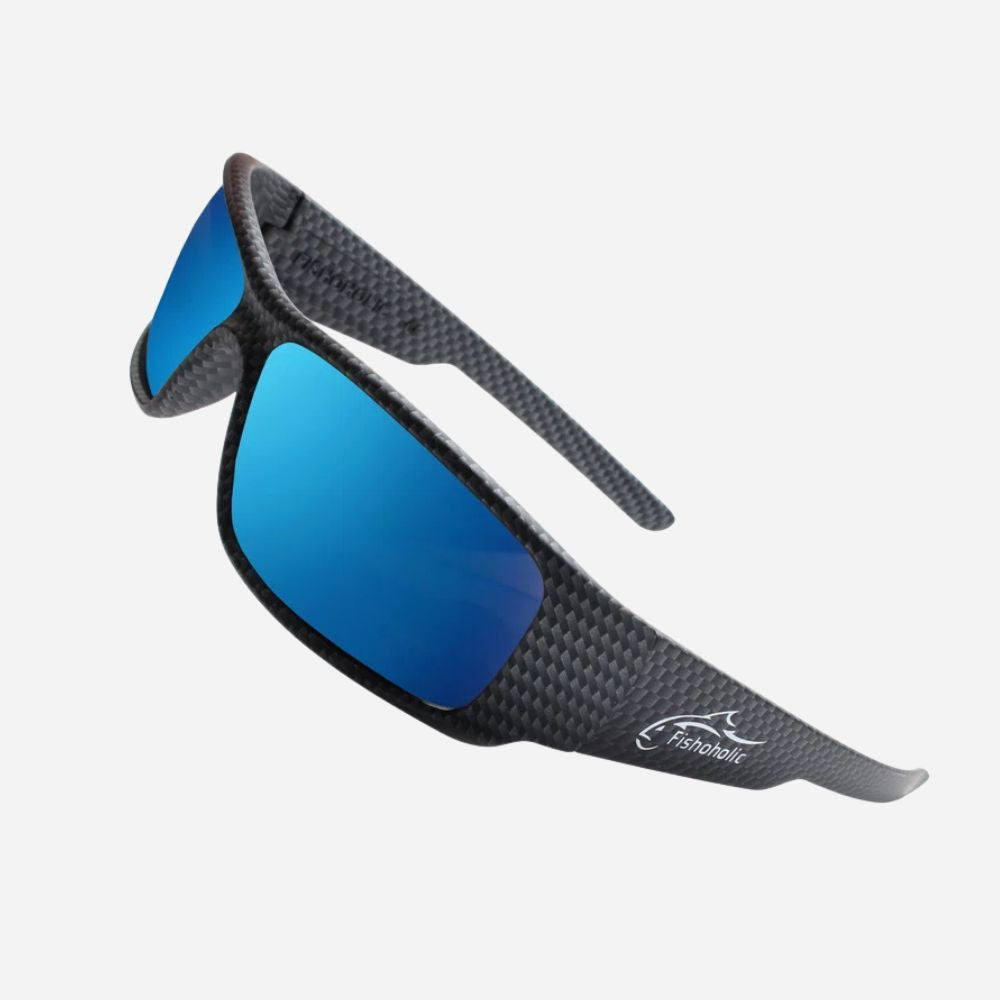 Sport sunglasses with a black carbon fiber pattern frame and mirrored blue lenses, featuring a white 'Fishbowl' logo on the temple arm, set against a light gray background.