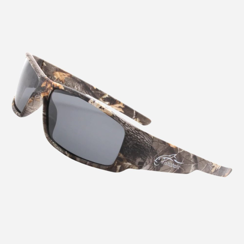 Wraparound sunglasses with a brown and black camouflage pattern frame and dark gray lenses, shown on a light gray background.