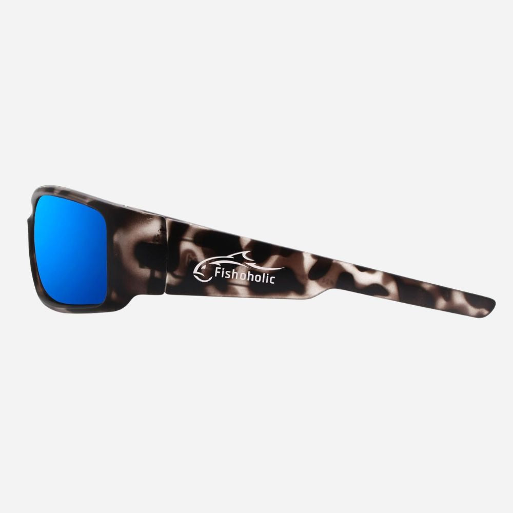 Fishholic wraparound sunglasses with a brown and black leopard print frame and bright blue mirrored lenses, shown from a side profile on a light gray background.