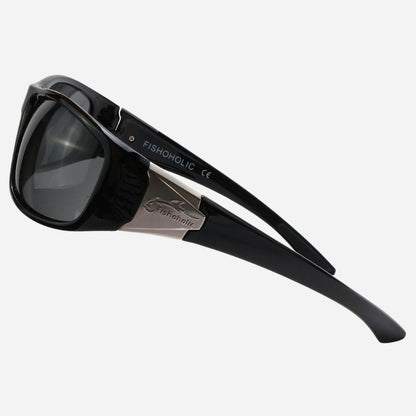 Black sunglasses with dark lenses and a silver metal bridge, featuring the brand name FISHONGLIC printed on the temple arm, set against a light gray background.