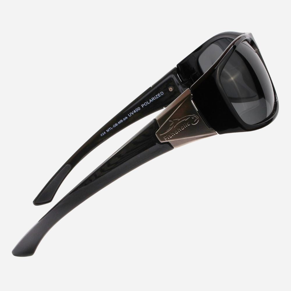 Black sunglasses with dark lenses and a bronze-toned metal bridge detail, shown on a light gray background.