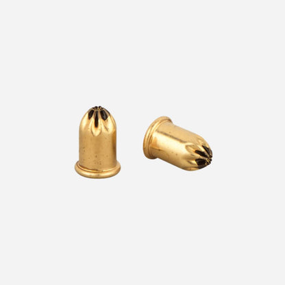 Two gold-colored bullet-shaped objects on a white background