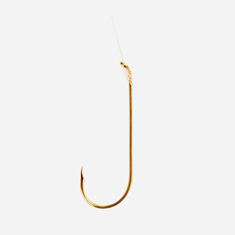 A single gold-colored fishing hook with a clear thread line attached at the top, shown against a plain light gray background.