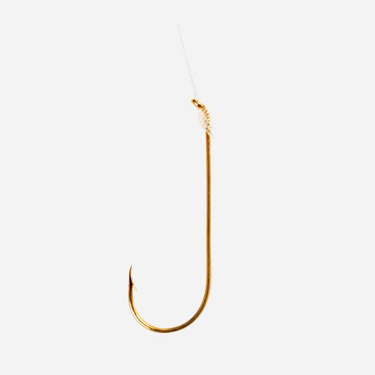 A single gold-colored fishing hook with a clear thread line attached at the top, shown against a plain light gray background.