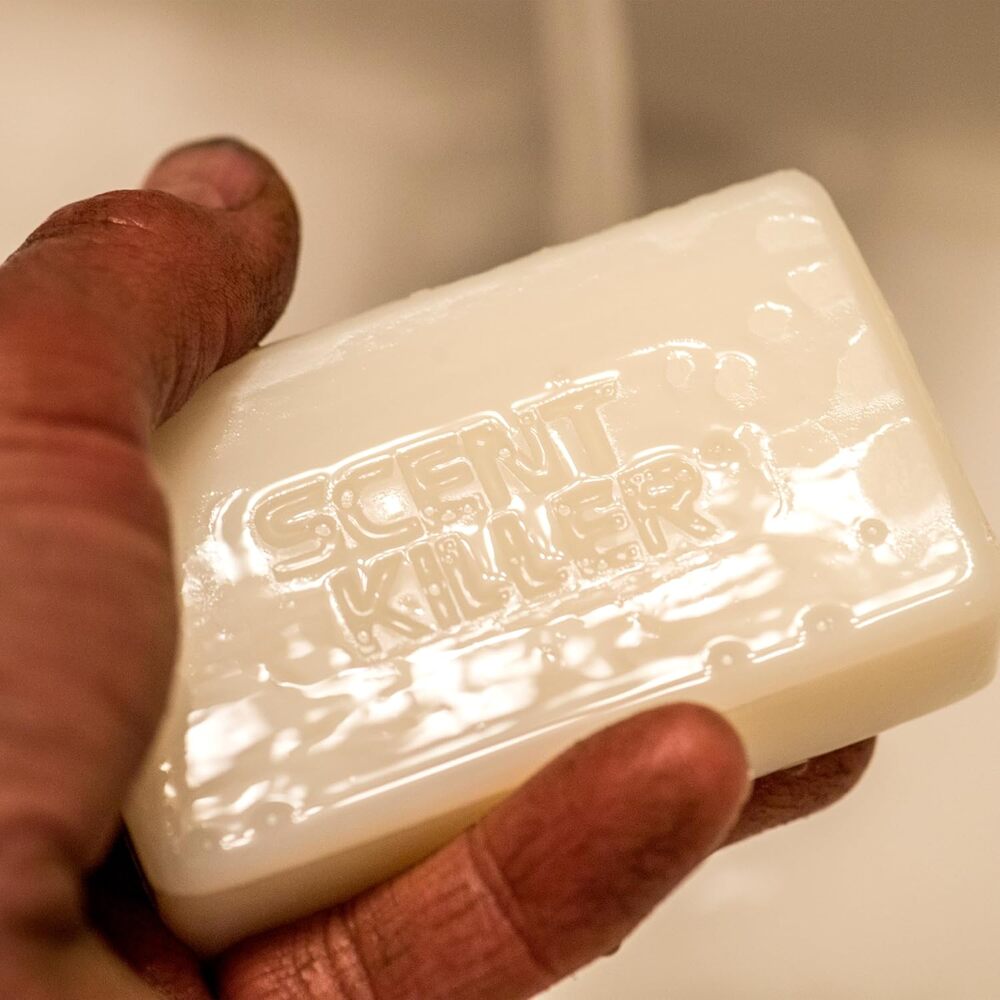 Bar of soap with 'SCENT KILLER' branding held in a hand.