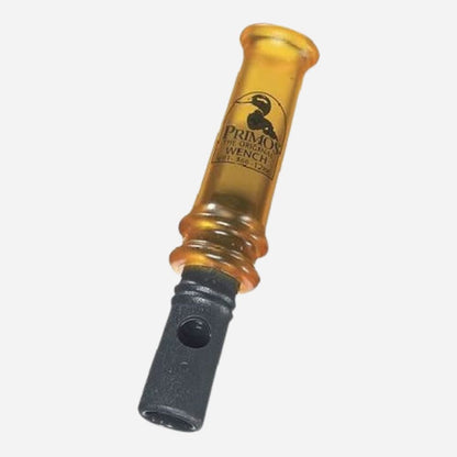 Yellow duck call with black bottom on a white background