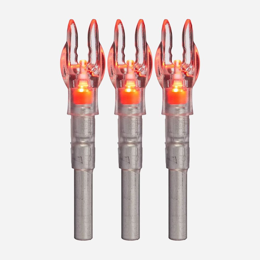 Three metallic arrow nocks with glowing orange tips on a white background