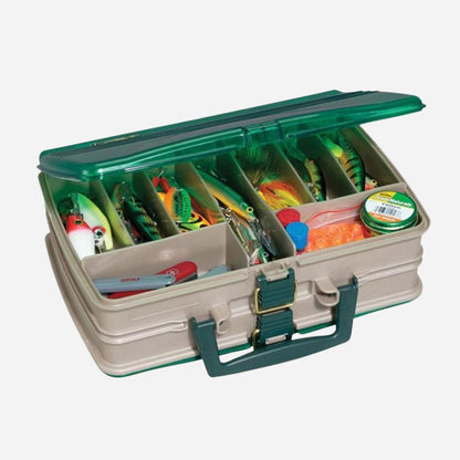 Fishing tackle box with colorful lures and tools on a white background