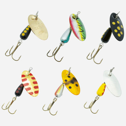 Six fishing spinnerbait lures arranged in two rows on a light gray background. The lures have treble hooks and are painted in various colors including yellow, black, red, green, blue, and silver.