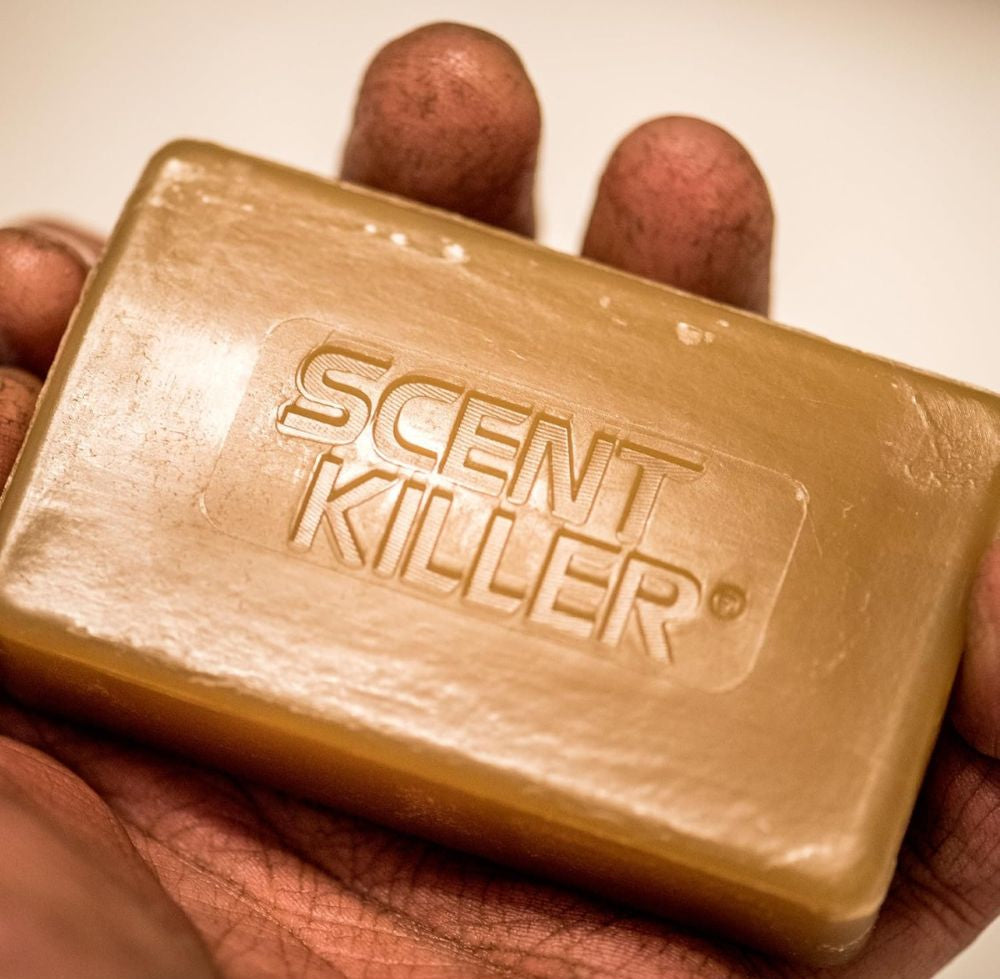 Bar of soap with 'Scent Killer' branding held in hands