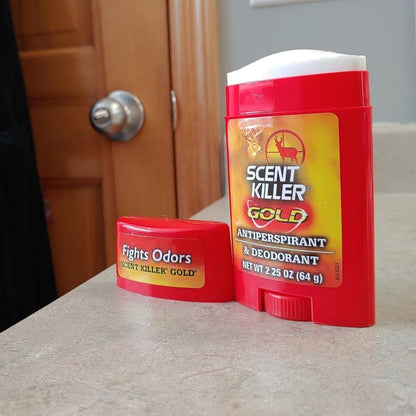 Scent Killer Gold antiperspirant and deodorant stick with cap removed displayed on a bathroom countertop