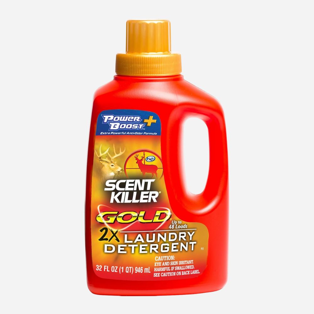Red bottle of Scent Killer Gold laundry detergent on a white background