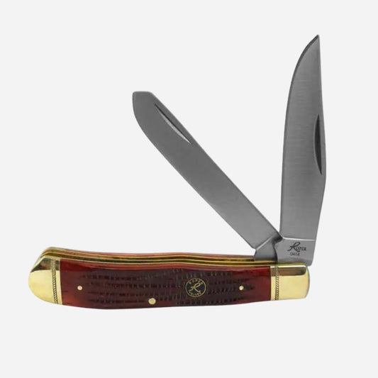 Trapper knife with wooden handle and gold accents on a white background