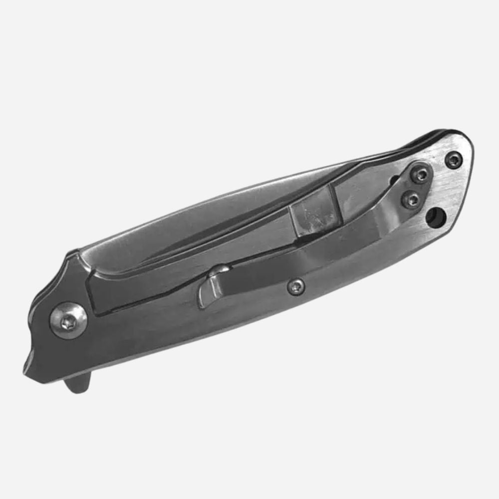 Folding knife with a metallic finish on a white background