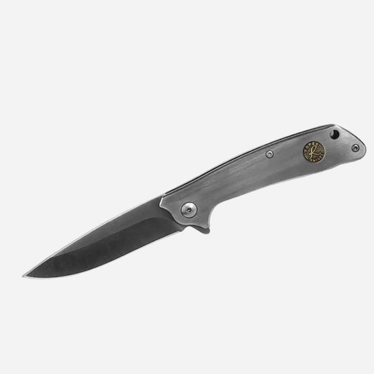 Folding knife with a metallic handle on a white background
