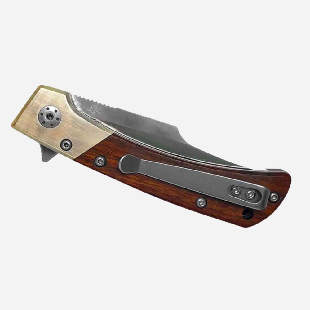 Folding knife with wooden handle and metallic accents on a white background