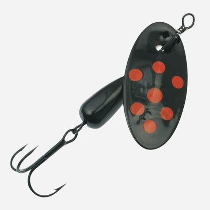 Black and red spinnerbait fishing lure on a white background