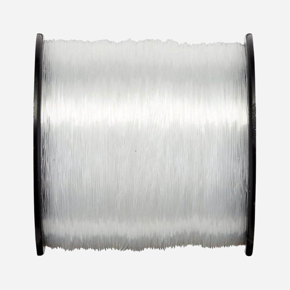 Spool of clear thread on a white background