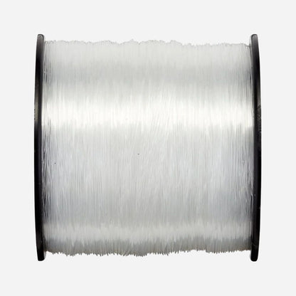 Spool of clear thread on a white background
