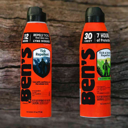 Two bottles of Ben's tick repellent on a wooden background