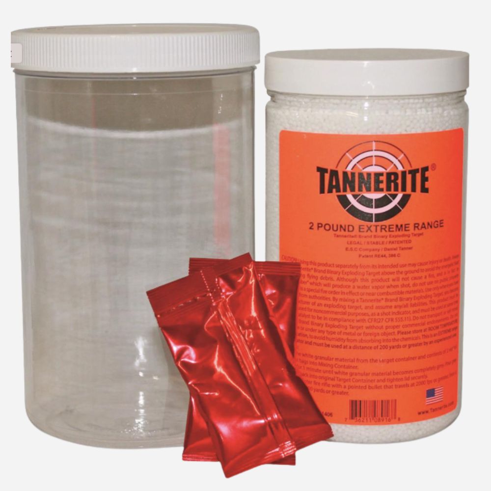 A clear plastic canister with a white lid, a white plastic jar labeled TANNERITE 2 POUND EXTREME RANGE, and three shiny red packets in front, shown on a plain white background.