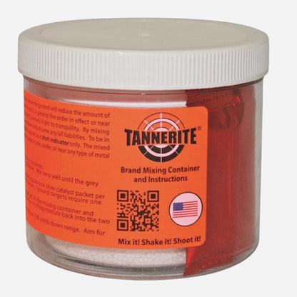 A clear plastic jar of Tannebite brand mixing container and instructions, filled with red powder, featuring a white screw-on lid and a bright orange label.