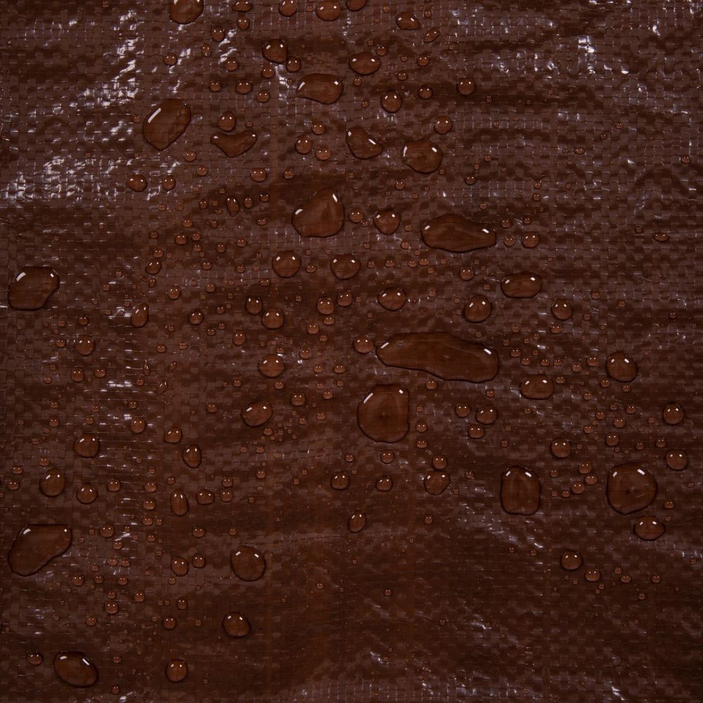 Brown textured surface with water droplets